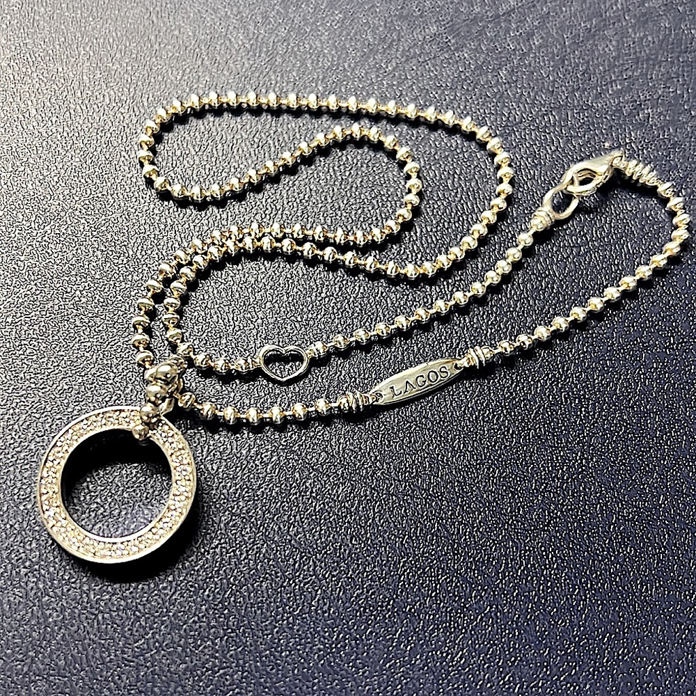 Sparkle in this Lagos Caviar Spark Circle Diamond Pendant.